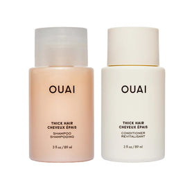 OUAI thick front packaging showing travel-size bottles and clear branding for convenience