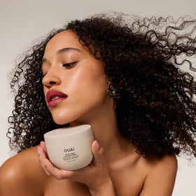 OUAI thick hair mask staged in bathroom showing lifestyle ease and routine benefit
