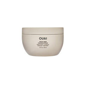 OUAI front tube of thick hair mask showing product name and size, highlights repair