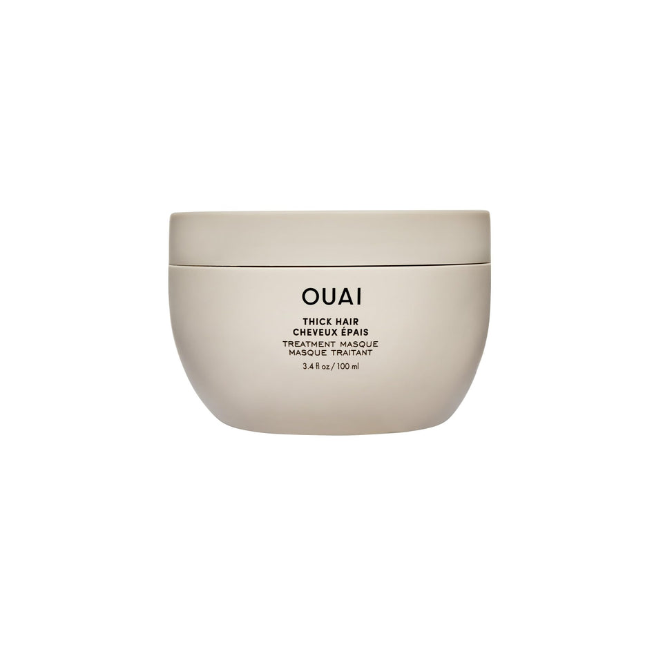 OUAI front tube of thick hair mask showing product name and size, highlights repair
