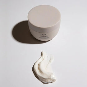 OUAI Melrose Place scent vial beside masque to suggest the rose and bergamot fragrance