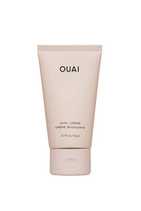 OUAI travel curl cream front tube showing compact travel-friendly packaging and portability