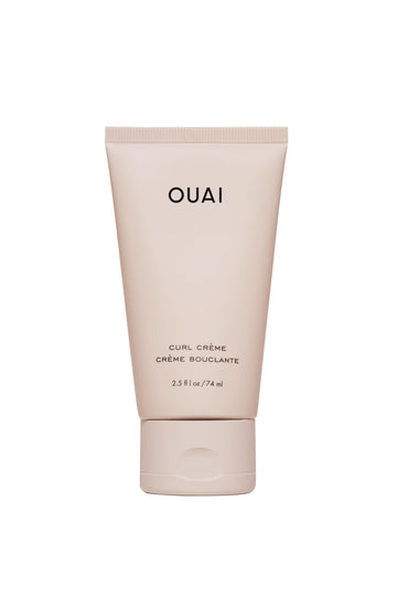 OUAI travel curl cream front tube showing compact travel-friendly packaging and portability