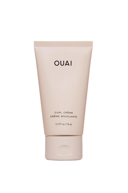 OUAI travel curl cream front tube showing compact travel-friendly packaging and portability