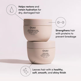 OUAI travel kit flatlay next to luggage highlighting TSA-friendly convenience