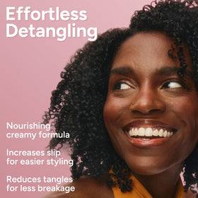 Ouidad defined, shiny curls after rinsing for visible frizz control