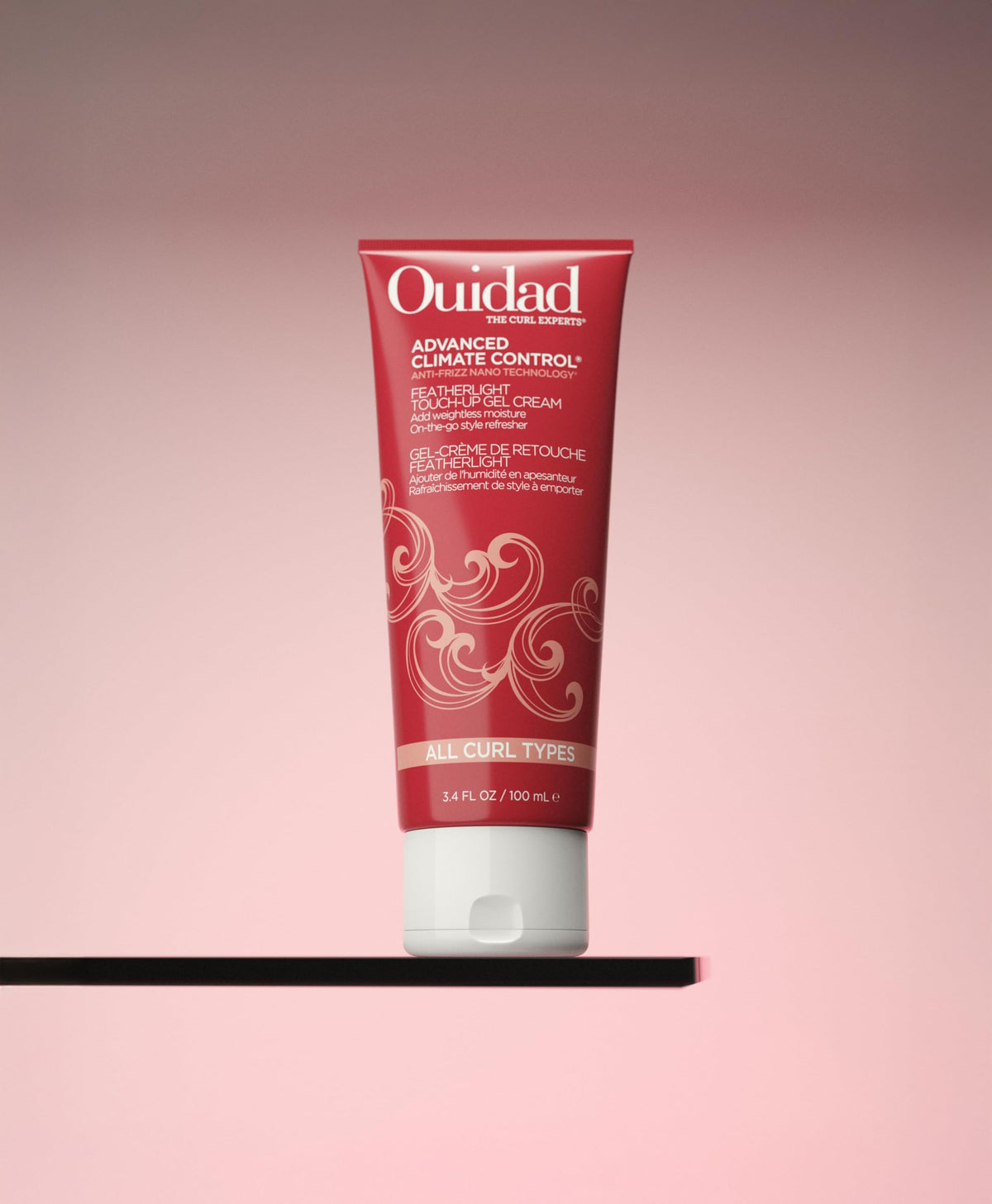 Ouidad applied to dry curls in hand to demonstrate easy on‑the‑go refresh