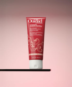 Ouidad applied to dry curls in hand to demonstrate easy on‑the‑go refresh