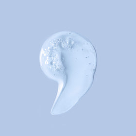 Ouidad foam on curly hair demonstrating gentle cleansing and improved definition