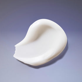 Applying Ouidad conditioner in shower to reduce tangles and improve manageability