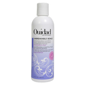 Ouidad front packaging showing bottle and clear product identity for gentle repair