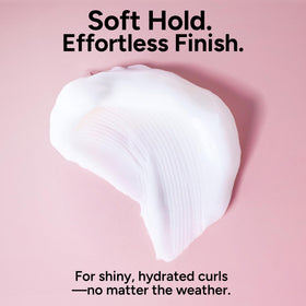 ouidad bottle held in hand to show 5.7 fl oz size and travel-friendly benefit
