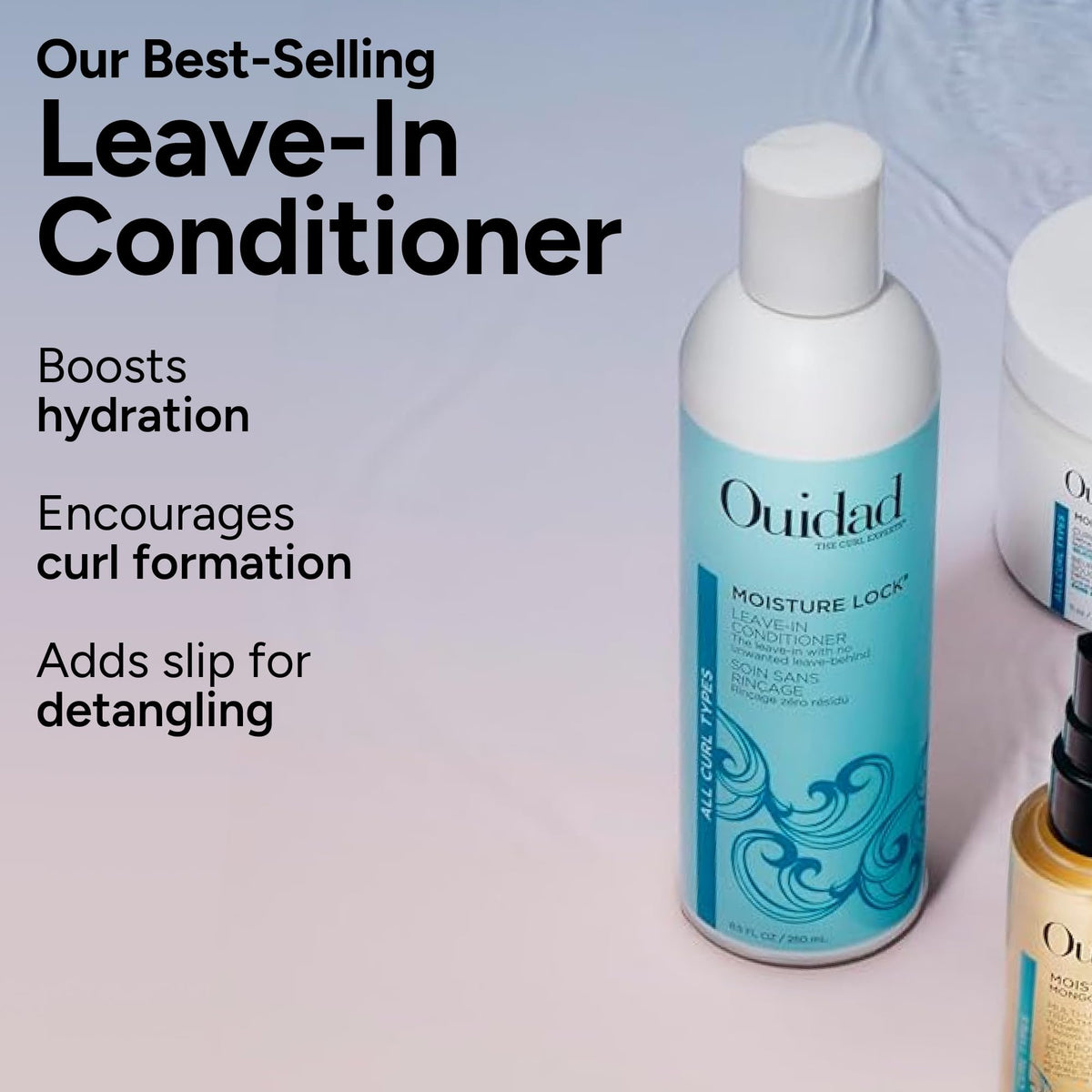 Hand holding Ouidad kit to show size and travel-friendly scale
