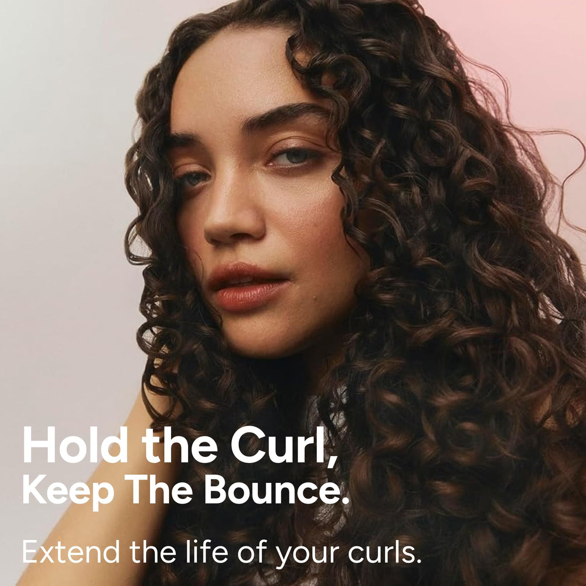 Ouidad gel in a diffuser scene showing improved curl volume and faster drying