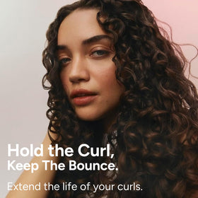 Ouidad gel in a diffuser scene showing improved curl volume and faster drying