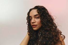 Ouidad VitalCurl ingredients label highlighting niacinamide, biotin and Botanical Omega