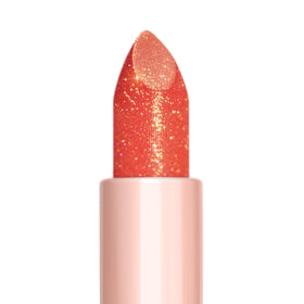Oulac applied on model lips showing subtle coral glow and improved radiance