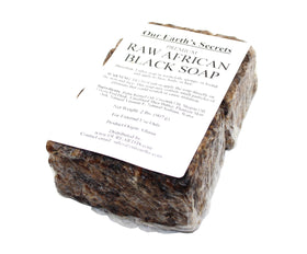 Our Earth's Secrets close-up texture of raw soap with visible plant particles benefit