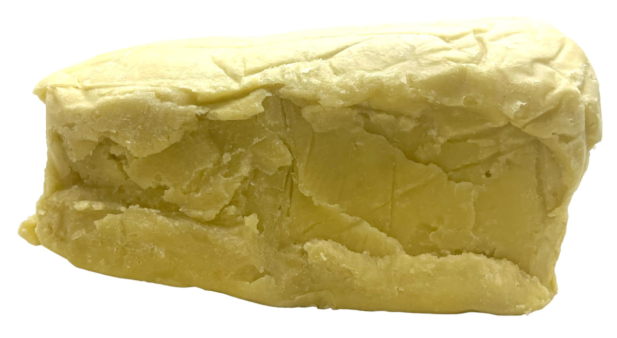 Our Earth's Secrets shea butter front block showing natural ivory color and quality