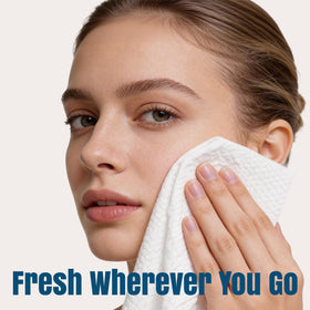 ourmed life towel next to a hand for scale, visualizing travel-friendly size