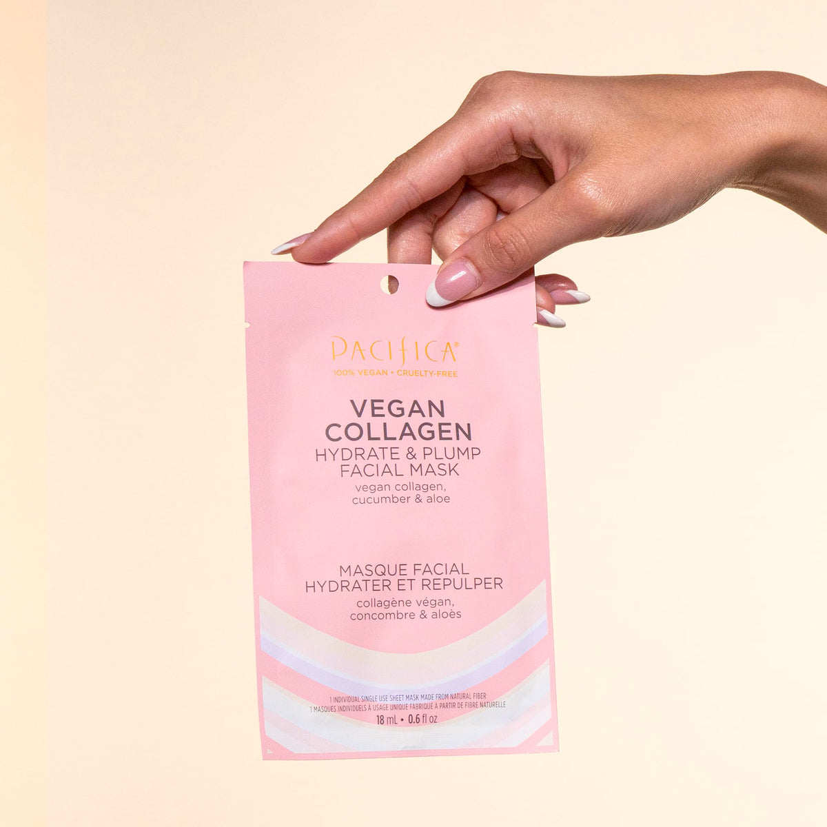 Pacifica mask beside a hand to show size and full-face coverage