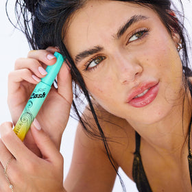 Pacifica Surf Lash next to a coin showing compact size and travel-friendly portability benefit