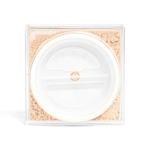 Palladio powder being picked up by a fluffy brush for effortless application