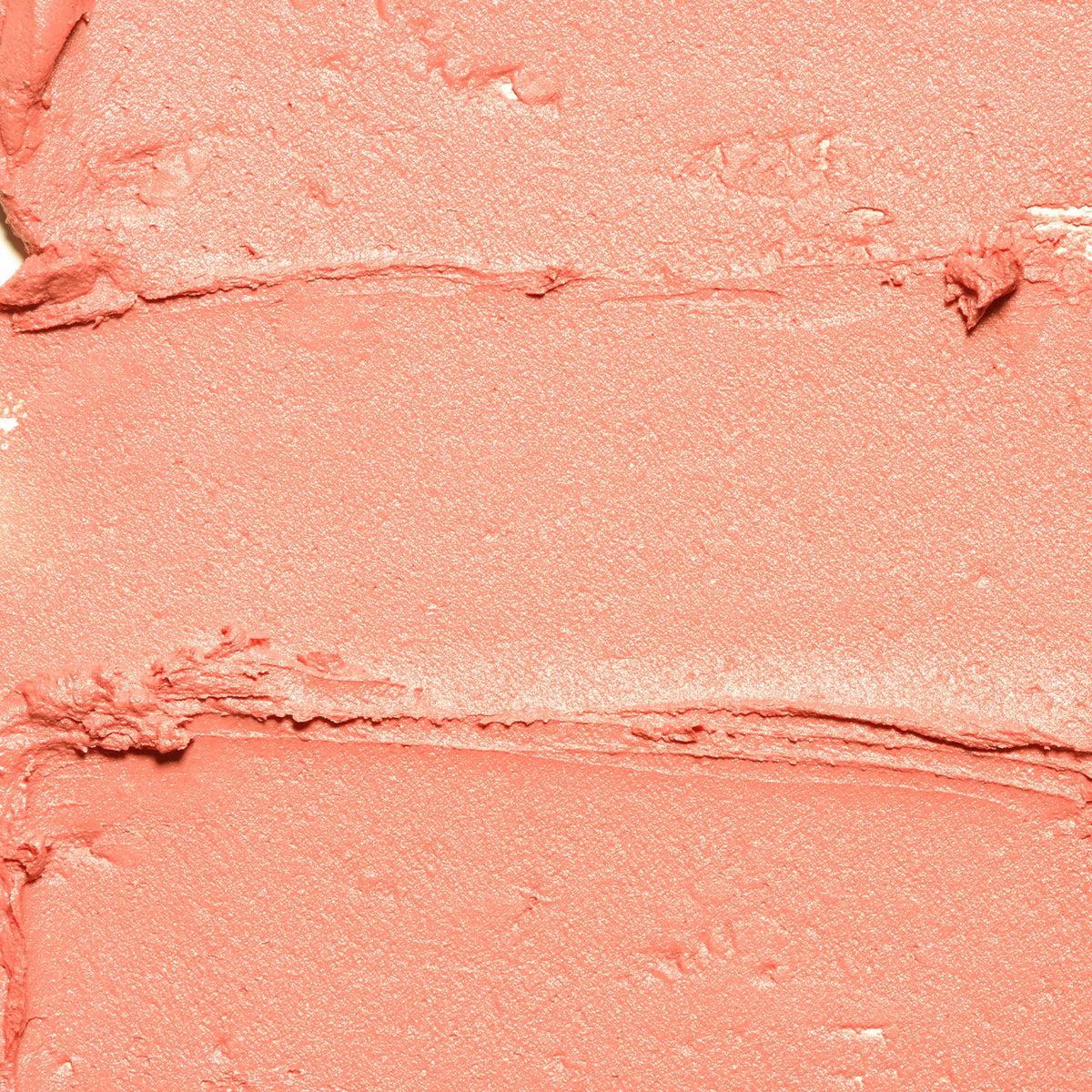 Palladio closeup swatch of peach tint texture showing creamy blendability
