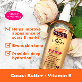 Palmer's pump dispensing body oil drops, demonstrating easy controlled application