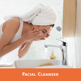 Palmer's cleansing oil in hand demonstrating gentle massage application