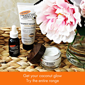 Bathroom scene with Palmer's scrub near towel and moisturizer suggesting daily routine convenience