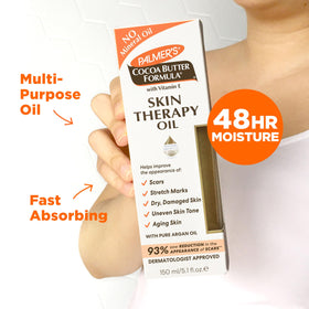 Palmer's oil texture on hand highlighting quick-absorbing finish