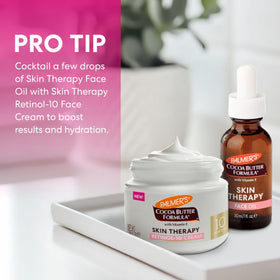 Palmer's cream blended under makeup to show non-greasy finish and smooth base