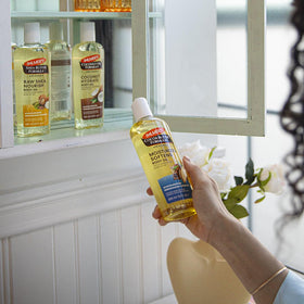 Palmer's raw shea oil applied on arm demonstrating calming, softening effect