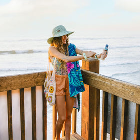 Panama Jack sunscreen being rubbed into arm for thorough, streak-free coverage