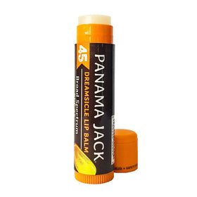 Model applying Panama Jack lip balm at the beach conveying soothing sun defense