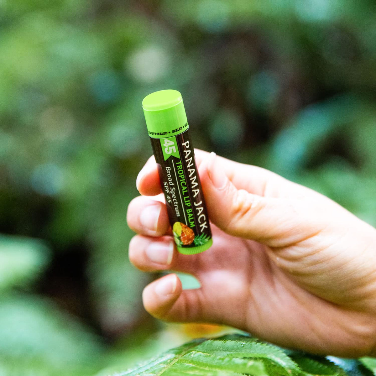 Panama Jack balm next to keys showing compact pocket-friendly sun care