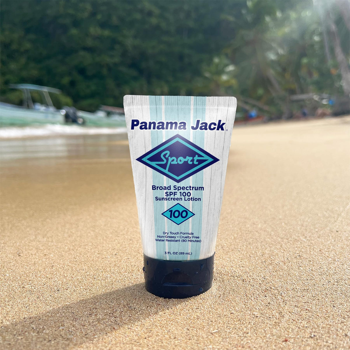 Panama Jack bottle placed on beach towel illustrating outdoor use benefit