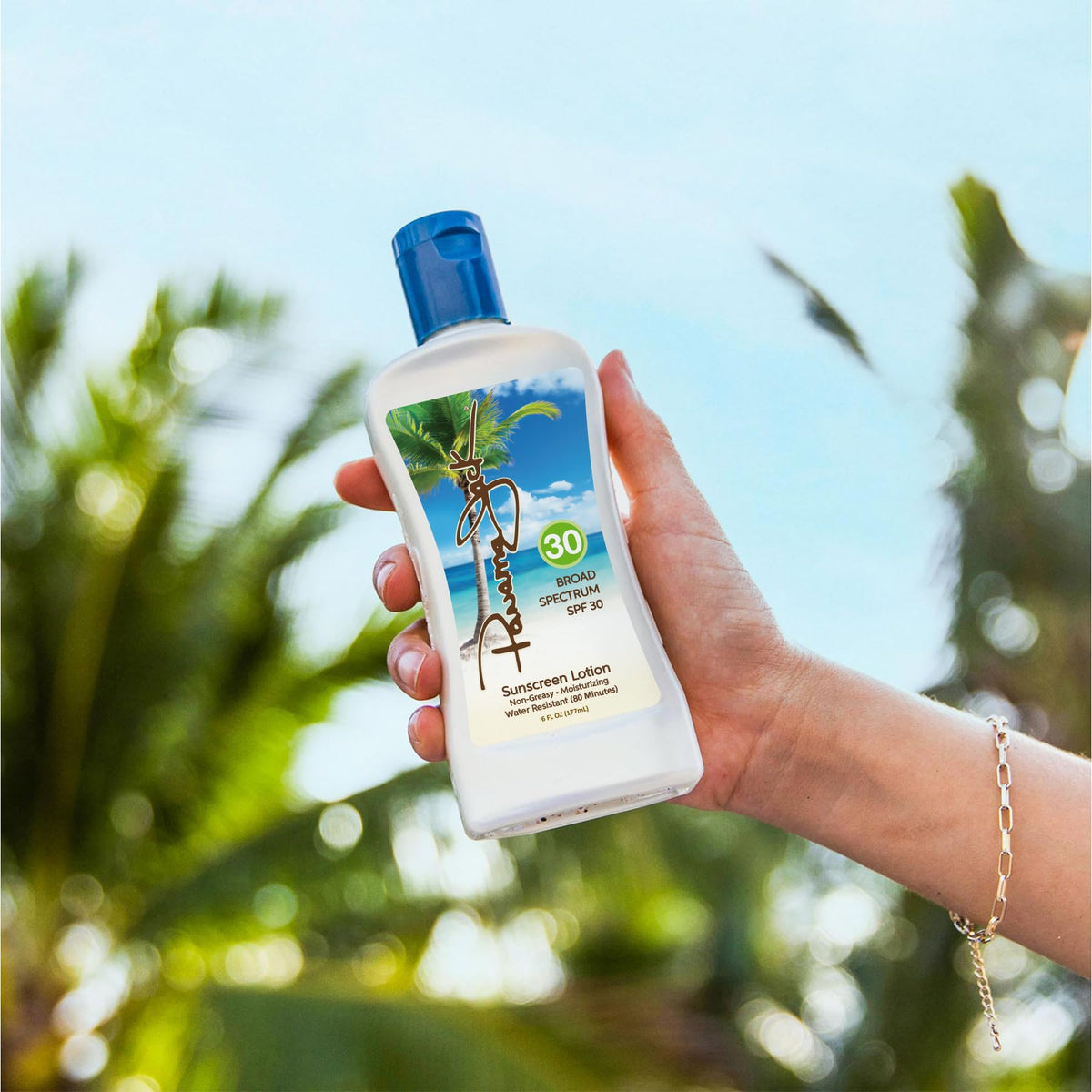 Panama Jack bottles in hand showing travel-friendly 6 fl oz size and portability benefit