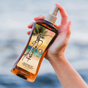 Panama Jack oil texture drop on skin highlighting moisturizing, dewy finish