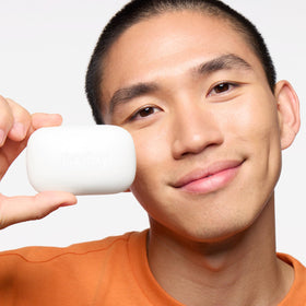 PanOxyl bar placed in shower illustrating convenient body use