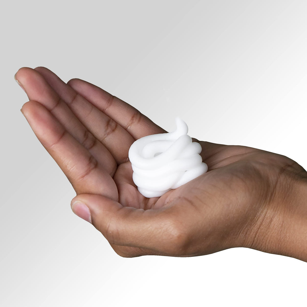 Pantene conditioner being massaged into wet hair for smoother strands
