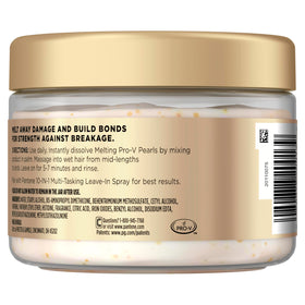 Jar on bathroom shelf styled with towels showing Pantene fitting into daily routine