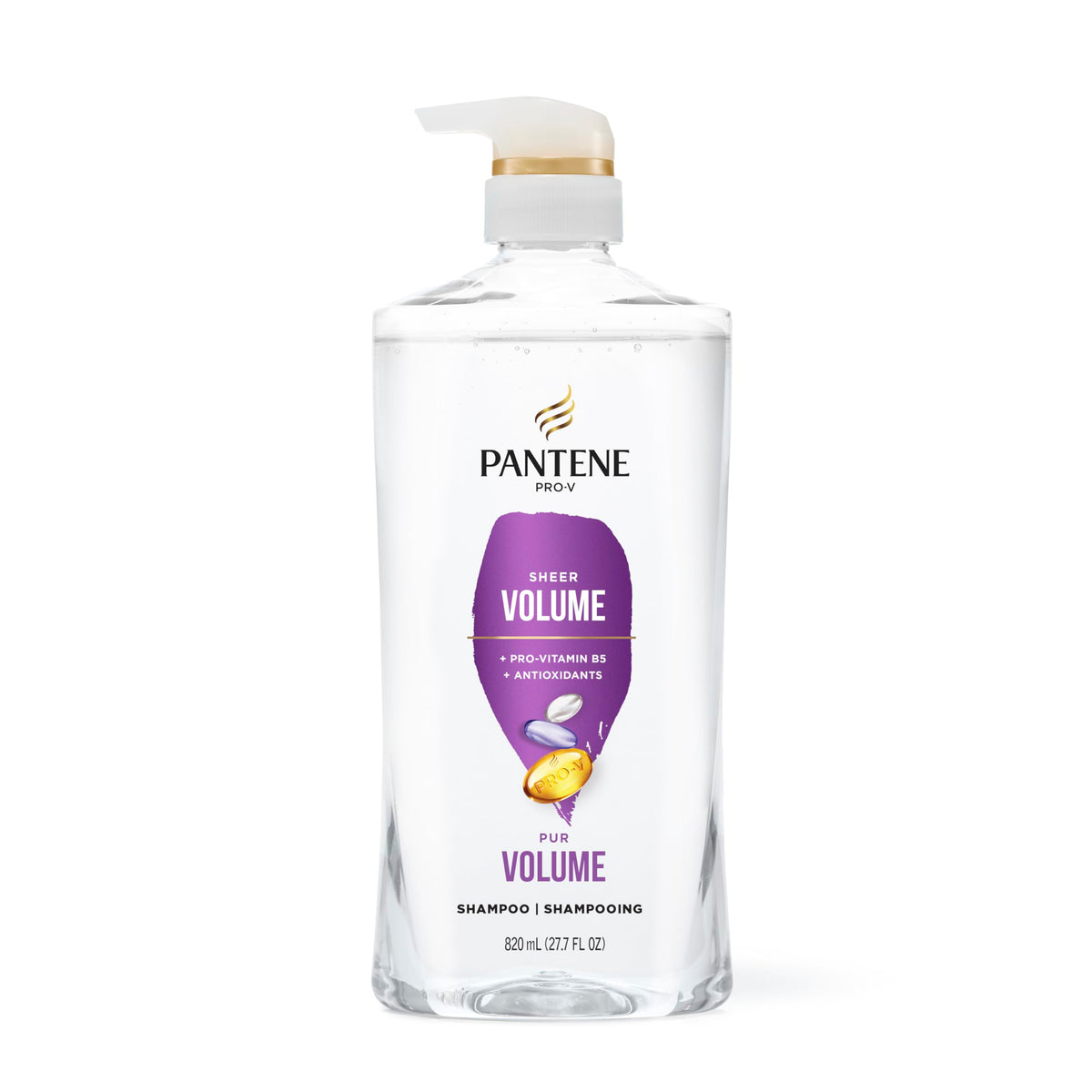 Person styling hair after using Pantene for visible fuller blowout
