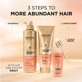 Woman using Pantene for fuller-looking, voluminous hair in lifestyle scene