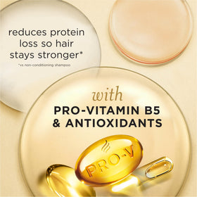 Hand holding Pantene bottle to show 8.5 fl oz scale and convenience