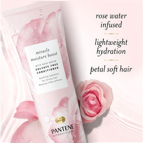 Pantene bottle held in hand showing 8 fl oz scale and travel size