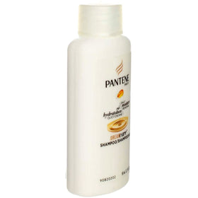 Pantene travel-size bottle held in hand illustrating compact, TSA-friendly convenience