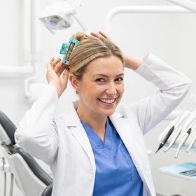 PANTIDE on desk with scrubs illustrating practical gift for dental professionals