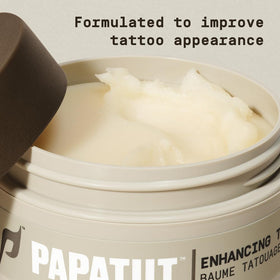 PAPATUI beside a coin for size comparison showing travel-friendly 2oz benefit